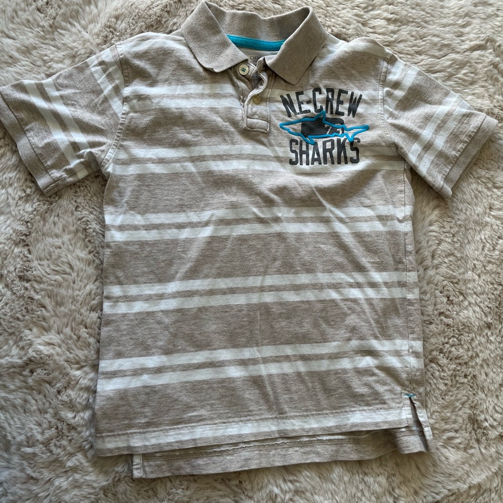Boys polo shirt.  Sharks.  Cherokee medium. 7/8. White and tan.